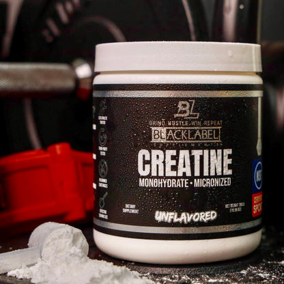 BlackLabel Creatine Monohydrate Micronized supplement container on a dark surface with blurred background