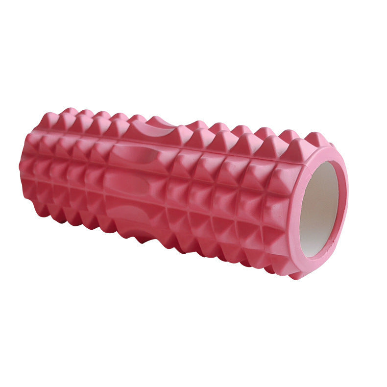 Pink high-density textured foam roller with a multi-zone massage surface, designed for stretching, muscle massage, yoga, Pilates, fitness training, and post-workout recovery, displayed on a white background.