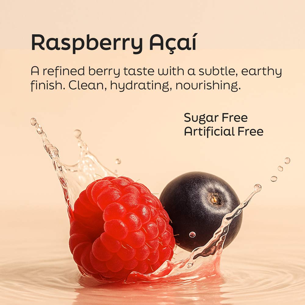 Fresh raspberry and açaí berry with water splash highlighting the Raspberry Açaí flavor of Root'd Her Multi daily wellness drink mix, featuring a sugar-free and artificially flavored-free formula.