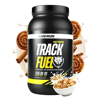 Black TrackFuel whey protein powder container with cinnamon roll and cinnamon cereal graphics, featuring 25g of protein, BCAAs, and digestive enzymes on a white background.