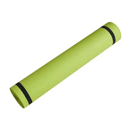 Green 6mm TPE yoga mat rolled with black straps featuring textured surface for yoga, Pilates, stretching, and fitness workouts
