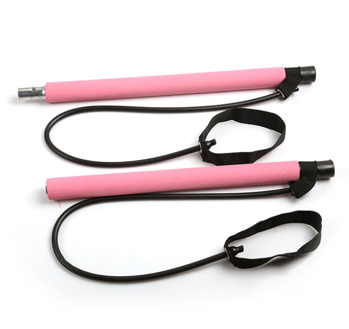 Pink portable Pilates bar resistance band training kit with detachable exercise bar, foam grips, resistance bands, and adjustable foot straps for full-body home workouts and Pilates training.