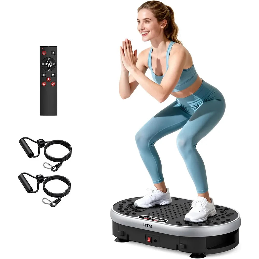 Woman performing a squat on a vibration plate exercise machine with wireless remote control and resistance bands for full-body home fitness workouts.