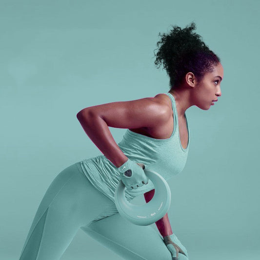 Woman performing a bent-over row exercise while holding a light blue adjustable dumbbell in a home fitness setting.